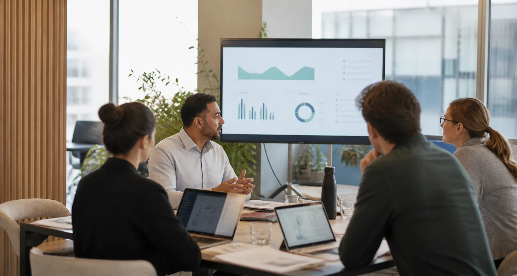 A professional team reviewing customer context together in a modern office